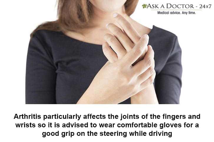 woman holding her righthand finger in pain=